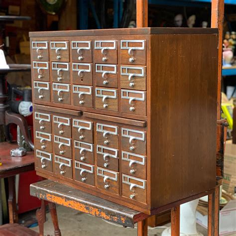 Seller's Notes This wooden storage piece with 150 drawers was acquired directly from a hardware store in Connecticut in which it was used, after functioning as a library card catalog. . Old library card catalog for sale